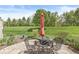 Backyard patio with an outdoor seating area and a well-manicured lawn at 10143 Winslow Way, Fishers, IN 46037