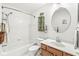 Bright bathroom featuring a tub/shower combination and a classic vanity with oak cabinetry at 10143 Winslow Way, Fishers, IN 46037