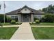 Attractive clubhouse featuring a symmetrical design, beautiful landscaping, and American flag at 10143 Winslow Way, Fishers, IN 46037