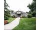 Attractive clubhouse featuring landscaped grounds, flower beds, and brick facade at 10143 Winslow Way, Fishers, IN 46037