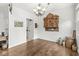 Bright dining room with hardwood floors, decorative wall accents, and natural light from a window at 10143 Winslow Way, Fishers, IN 46037