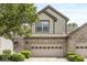 Charming home with a two-car garage, decorative door, beautiful brick accents, and landscaped front yard at 10143 Winslow Way, Fishers, IN 46037