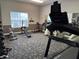 Community gym with various exercise equipment, including a treadmill and weights for residents' fitness needs at 10143 Winslow Way, Fishers, IN 46037