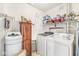 Functional laundry area with washer, dryer, and ample storage, perfect for household chores at 10143 Winslow Way, Fishers, IN 46037