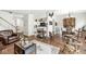 Spacious living room with hardwood floors, neutral walls, and abundant natural light at 10143 Winslow Way, Fishers, IN 46037