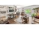 Living room with hardwood floors, slider to the patio and neutral wall color and plenty of natural light at 10143 Winslow Way, Fishers, IN 46037