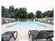 Enjoy the community pool featuring lounge chairs and a fenced perimeter for privacy at 10143 Winslow Way, Fishers, IN 46037