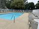Large swimming pool with plenty of lounge chairs surrounding, perfect for relaxation and recreation at 10143 Winslow Way, Fishers, IN 46037