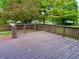 View of wood deck with surrounding greenery and neighboring houses at 10305 Lakeland Dr, Fishers, IN 46037