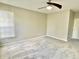 A spacious bedroom with a ceiling fan and a window allowing natural light at 10305 Lakeland Dr, Fishers, IN 46037
