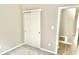 Bedroom with neutral walls, gray carpet, a sliding closet door, and an open access door at 10305 Lakeland Dr, Fishers, IN 46037