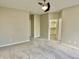 Well-lit bedroom featuring neutral tones and an adjacent closet, creating a bright and functional atmosphere at 10305 Lakeland Dr, Fishers, IN 46037
