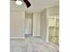 Bright bedroom featuring neutral tones and an adjacent closet, creating a bright and functional atmosphere at 10305 Lakeland Dr, Fishers, IN 46037