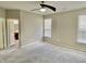 Inviting bedroom featuring neutral tones, plenty of natural light, and an adjacent bathroom, creating a welcoming space at 10305 Lakeland Dr, Fishers, IN 46037
