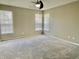 Spacious bedroom featuring a ceiling fan, neutral tones, and plenty of natural light, creating a bright atmosphere at 10305 Lakeland Dr, Fishers, IN 46037