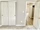 This bedroom features a closet and an open doorway, enhancing the appeal of the space at 10305 Lakeland Dr, Fishers, IN 46037