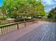 Large wooden deck with railings overlooking a lawn and a trees at 10305 Lakeland Dr, Fishers, IN 46037