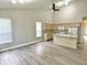 Open concept kitchen and dining area featuring hardwood floors, lots of natural light and neutral colored walls at 10305 Lakeland Dr, Fishers, IN 46037