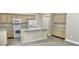 Spacious kitchen with stainless steel appliances, an island, and ample cabinetry, providing a modern and functional space at 10305 Lakeland Dr, Fishers, IN 46037