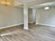 Open-concept living area with grey walls, hardwood floors, and recessed lighting at 10305 Lakeland Dr, Fishers, IN 46037