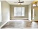 Sun-filled living area featuring new hardwood floors and neutral wall paint at 10305 Lakeland Dr, Fishers, IN 46037