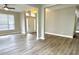 Bright living room featuring new floors, neutral paint, and a view into the entry at 10305 Lakeland Dr, Fishers, IN 46037