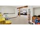 A spacious carpeted basement offers multiple living areas, perfect for a play area and separate entertainment space at 10310 Foxwood W Dr, Carmel, IN 46280