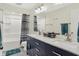 Modern bathroom featuring double sinks, sleek countertops, and elegant fixtures, blending style and functionality at 10310 Foxwood W Dr, Carmel, IN 46280