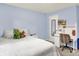 Cozy bedroom with carpet and white furnishings featuring a desk and chair perfect for studying or working from home at 10310 Foxwood W Dr, Carmel, IN 46280