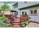 Lovely deck with steps, surrounded by lush landscaping, offering a serene outdoor space at 10310 Foxwood W Dr, Carmel, IN 46280