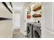 Well-organized laundry room with modern washer and dryer, and ample storage, making laundry chores a breeze at 10310 Foxwood W Dr, Carmel, IN 46280