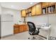 Home office featuring built-in cabinets and an ample workspace, providing an ideal environment for productivity and organization at 10310 Foxwood W Dr, Carmel, IN 46280