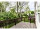 Wooden back deck area with lush greenery and scenic views at 1041 Lincoln Park E Dr, Greenwood, IN 46142