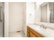 Bathroom vanity with granite countertops, mirror, and neutral decor at 1041 Lincoln Park E Dr, Greenwood, IN 46142