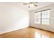 Well-lit bedroom with hardwood floors, white walls, and a bright window at 1041 Lincoln Park E Dr, Greenwood, IN 46142