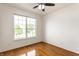 Bright bedroom with hardwood floors, ceiling fan, and large window at 1041 Lincoln Park E Dr, Greenwood, IN 46142