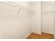 Walk-in closet with built-in wire shelving and hardwood floors at 1041 Lincoln Park E Dr, Greenwood, IN 46142