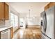 Open kitchen layout with stainless steel appliances, bright lighting, and seamless flow to other rooms at 1041 Lincoln Park E Dr, Greenwood, IN 46142