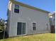 Picture of the back of the property, featuring an exterior view with vinyl siding and sliding glass doors at 10425 Candy Apple Ln, Indianapolis, IN 46235