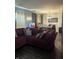 Inviting living room featuring a large sectional sofa, hardwood floors, and ample space for dining at 10425 Candy Apple Ln, Indianapolis, IN 46235