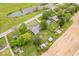 Aerial view of a lovely home with a backyard pool and landscaping near a picturesque pond and surrounding farmland at 10456 N State Rd 267, Brownsburg, IN 46112