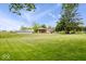 Expansive, green backyard is perfect for outdoor entertaining. Includes pool, gazebo, and storage at 10456 N State Rd 267, Brownsburg, IN 46112