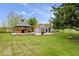 Landscaped backyard features an outdoor gazebo, storage shed and mature shade trees at 10456 N State Rd 267, Brownsburg, IN 46112