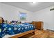 Bright bedroom with hardwood floors, window, bed and adjacent dresser at 10456 N State Rd 267, Brownsburg, IN 46112