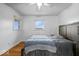 Bedroom featuring light hardwood floors, a ceiling fan, bed and a window at 10456 N State Rd 267, Brownsburg, IN 46112