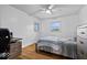 Bedroom with a desk, chair, queen bed, and light hardwood floors at 10456 N State Rd 267, Brownsburg, IN 46112