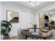 Dining area featuring hardwood floors, modern decor, and access to the living area at 10456 N State Rd 267, Brownsburg, IN 46112