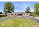 Charming single-story home featuring a circular driveway and well-maintained lawn at 10456 N State Rd 267, Brownsburg, IN 46112