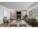 Stylish living room featuring hardwood floors, contemporary furniture, and a stone fireplace at 10456 N State Rd 267, Brownsburg, IN 46112