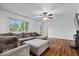 Spacious living room with large windows, hardwood floors, and comfortable seating at 10456 N State Rd 267, Brownsburg, IN 46112